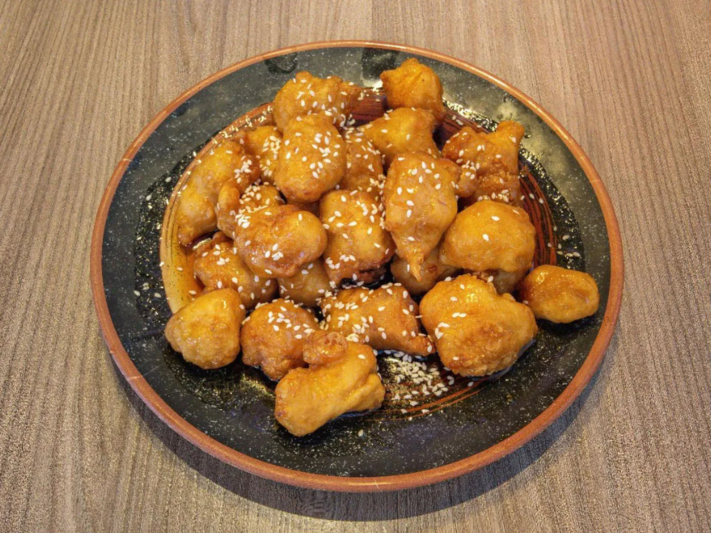 Crispy chicken with sesame seeds & sweet sauce at Uncle Qwik Chinese & Dumpling Restaurant, a Chinese Restaurant in Scottsdale